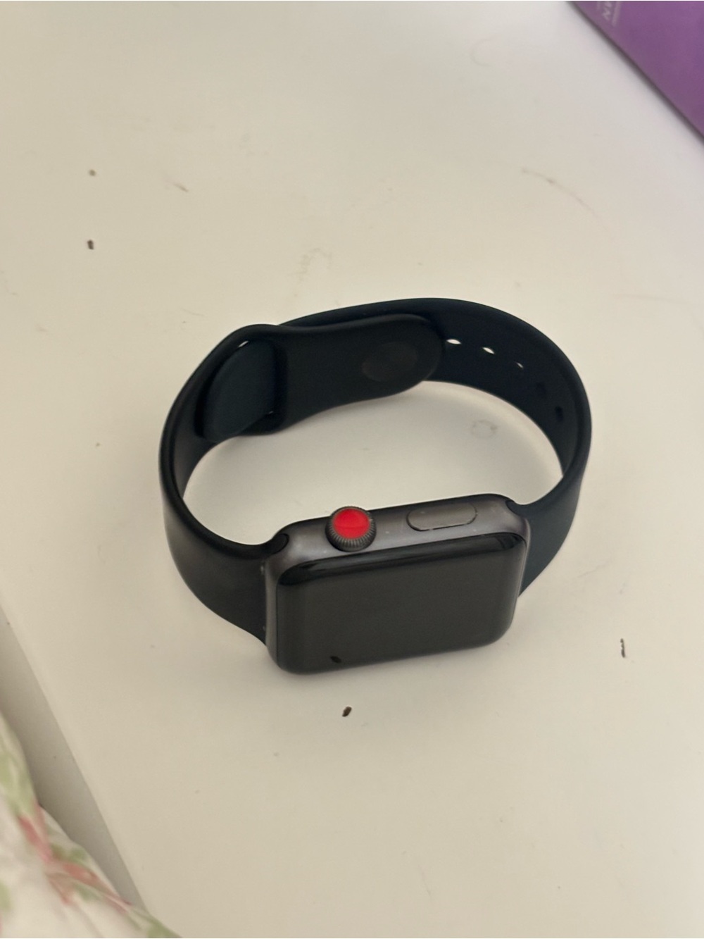 Apple Smartwatch in Space Gray with Black Band and Red Digital Crown